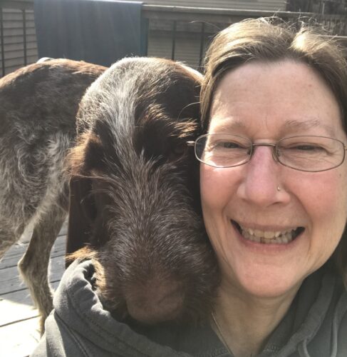 dog's head on human's shoulder